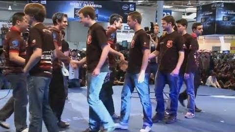 Two esports players handshake on stage